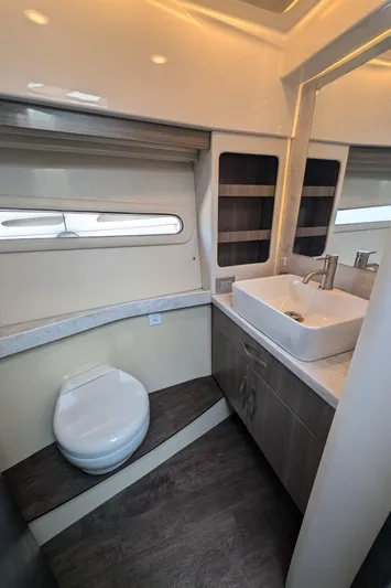  Yacht Photos Pics 2020 Regal 38 Grande Coupe bathroom with modern fixtures and sleek design.