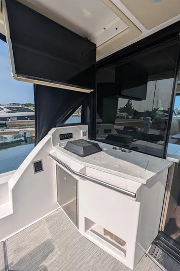  Yacht Photos Pics 2020 Regal 38 Grande Coupe yacht interior with modern kitchenette and sleek design.