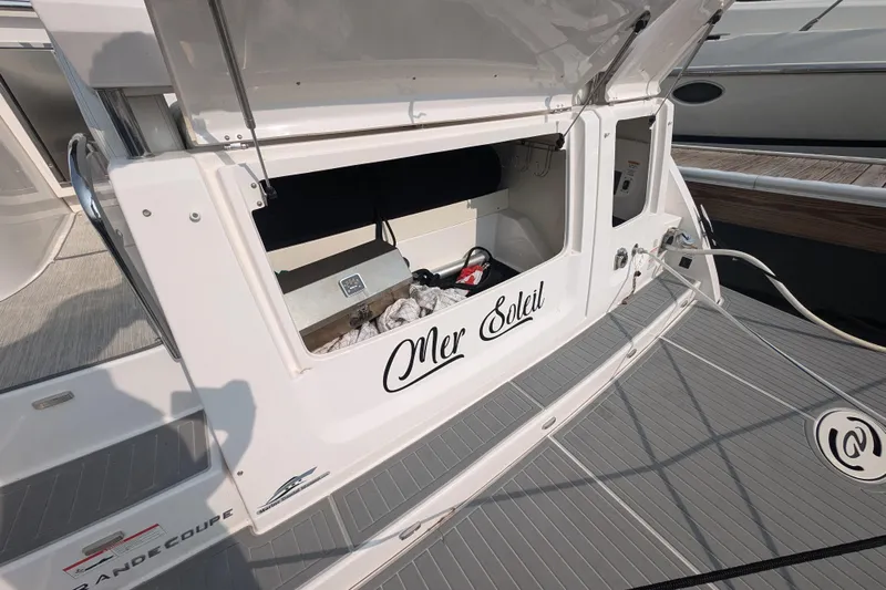  Yacht Photos Pics 2020 Regal 38 Grande Coupe yacht with open storage compartment on deck.
