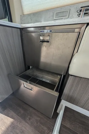  Yacht Photos Pics 2020 Regal 38 Grande Coupe interior with open stainless steel drawer and modern design.