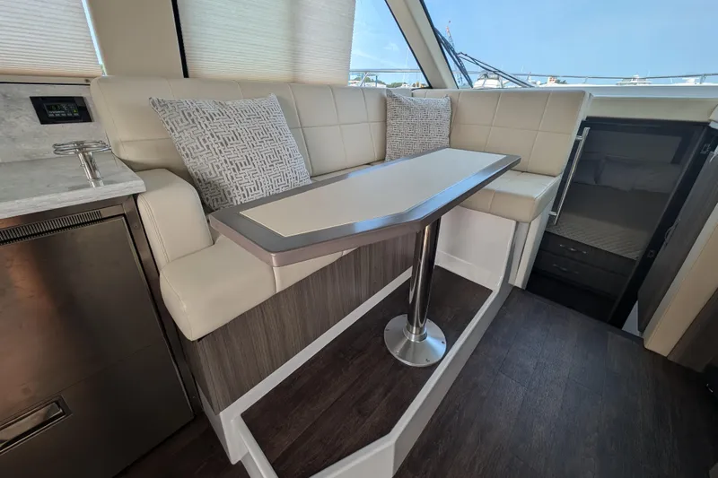  Yacht Photos Pics Interior of 2020 Regal 38 Grande Coupe with modern seating and table.