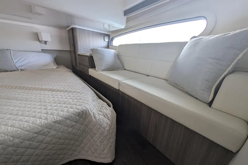  Yacht Photos Pics Interior of 2020 Regal 38 Grande Coupe with bed and seating area.