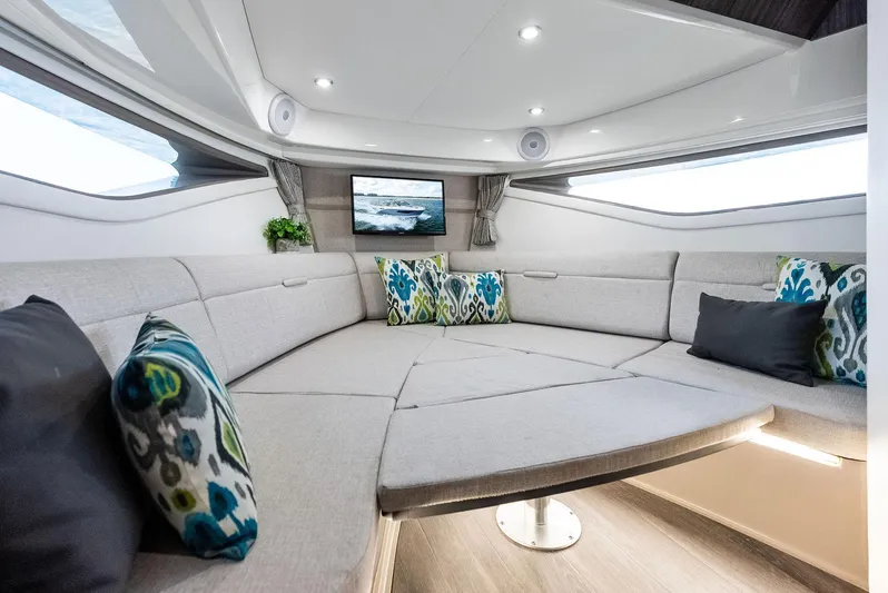 Swelltimes IV Yacht Photos Pics Luxurious interior of 2022 Sea Ray Sundancer 320 OB with elegant seating and decor.