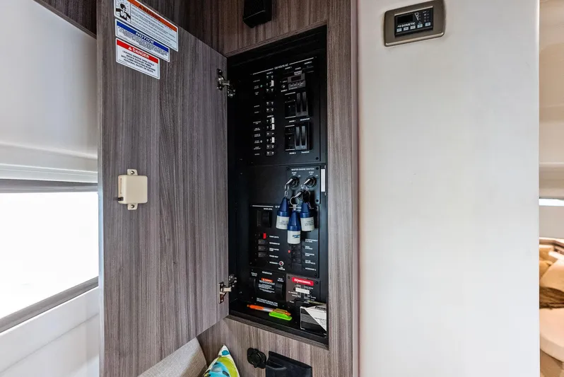 Swelltimes IV Yacht Photos Pics Electrical panel inside 2022 Sea Ray Sundancer 320 OB boat, featuring modern controls and wiring.