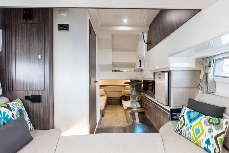 Swelltimes IV Yacht Photos Pics Interior of 2022 Sea Ray Sundancer 320 OB, featuring modern design and comfortable seating.