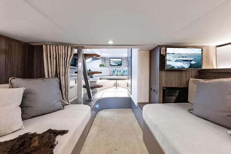 Swelltimes IV Yacht Photos Pics Interior of 2022 Sea Ray Sundancer 320 OB, featuring cozy seating and modern amenities.