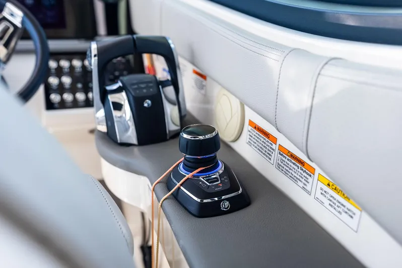 Swelltimes IV Yacht Photos Pics Control panel of 2022 Sea Ray Sundancer 320 OB boat, featuring modern joystick and throttle.