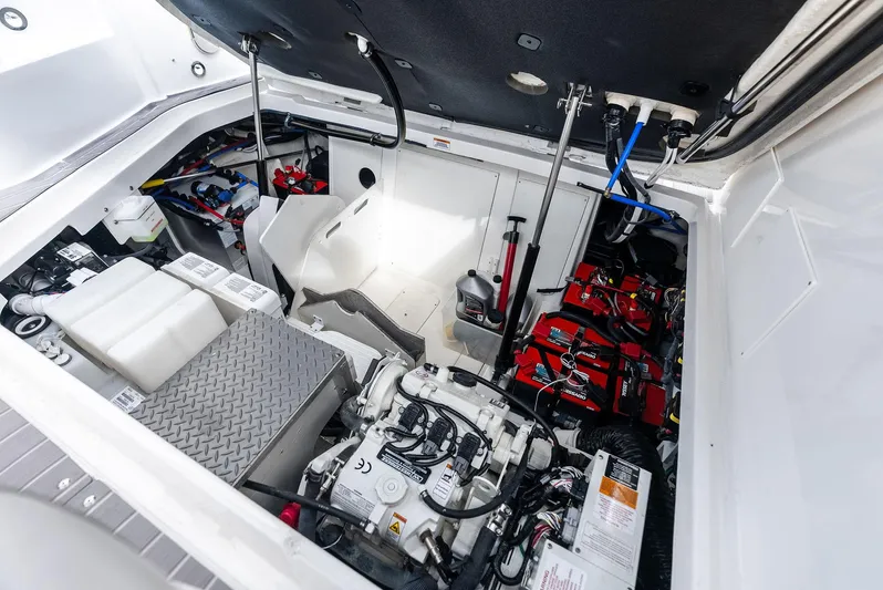 Swelltimes IV Yacht Photos Pics Engine compartment of 2022 Sea Ray Sundancer 320 OB, showcasing mechanical components and wiring.