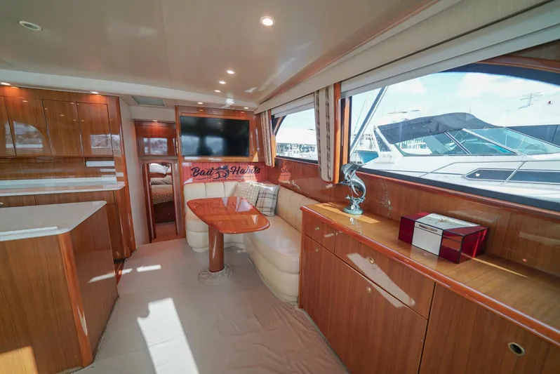 Bad Habits Yacht Photos Pics Luxurious interior of a 2007 Viking 45 Convertible yacht with elegant wood finishes.