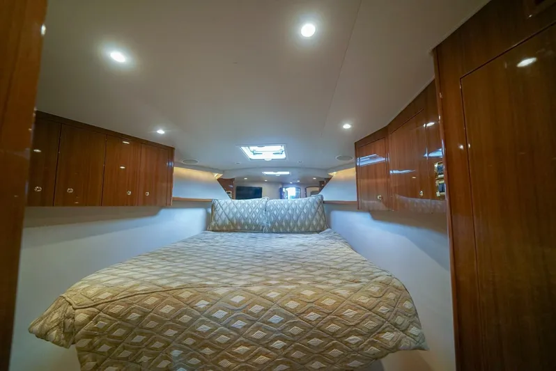 Bad Habits Yacht Photos Pics Luxurious cabin interior of 2007 Viking 45 Convertible yacht with elegant wood finish.