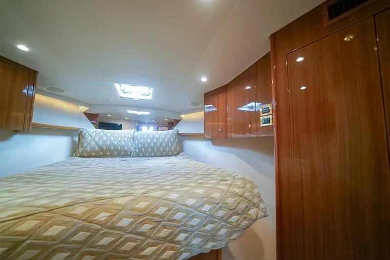Bad Habits Yacht Photos Pics Luxurious cabin interior of 2007 Viking 45 Convertible yacht with elegant wood finish.