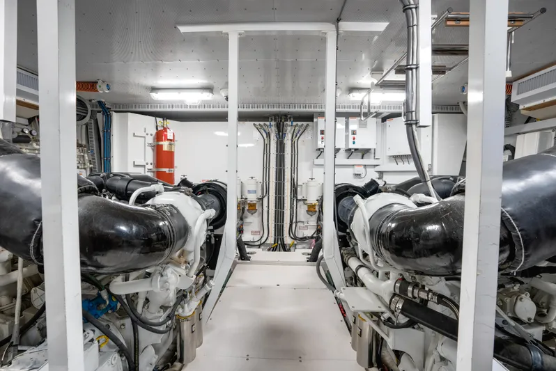 Family Tradition II Yacht Photos Pics Engine room of 2012 Neptunus 750FX yacht, featuring dual engines and safety equipment.