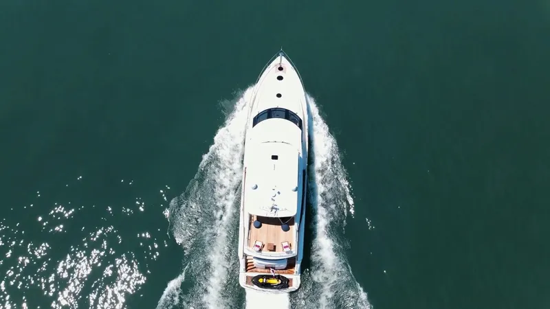 Family Tradition II Yacht Photos Pics Aerial view of 2012 Neptunus 750FX yacht cruising on open water.