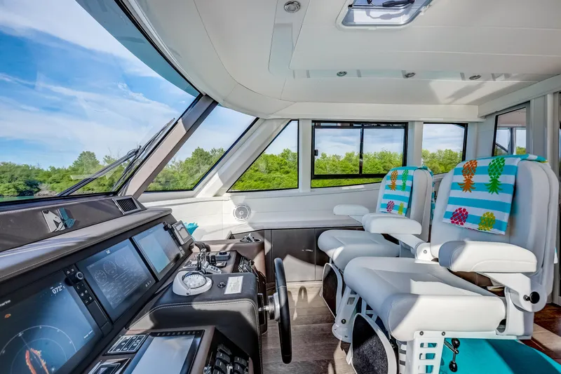 Family Tradition II Yacht Photos Pics Interior of 2012 Neptunus 750FX yacht with modern cockpit and colorful seating.