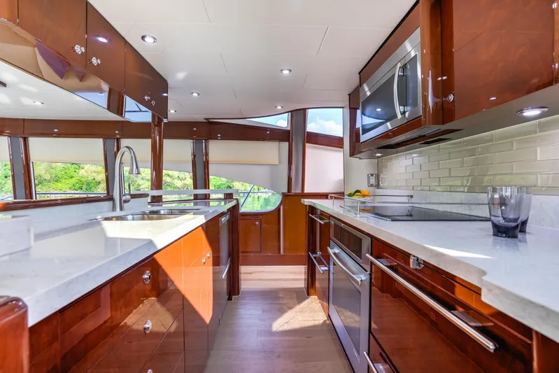 Family Tradition II Yacht Photos Pics Luxurious Neptunus 750FX yacht kitchen with modern appliances and sleek wood finishes, 2012 model.