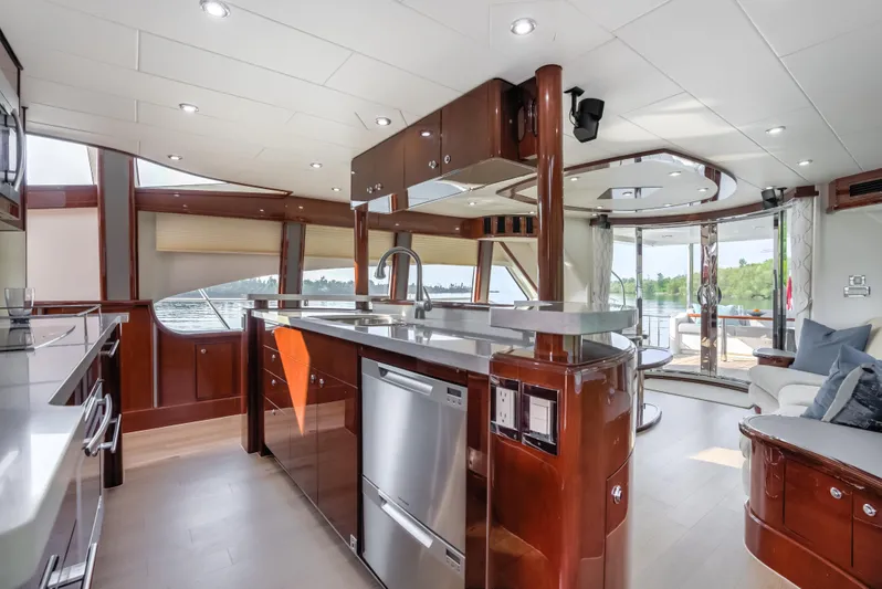 Family Tradition II Yacht Photos Pics Luxurious interior of 2012 Neptunus 750FX yacht with modern kitchen and scenic views.