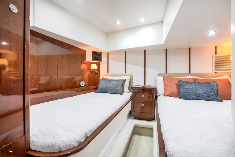 Family Tradition II Yacht Photos Pics Luxurious Neptunus 750FX 2012 yacht cabin with twin beds and elegant wood finishes.