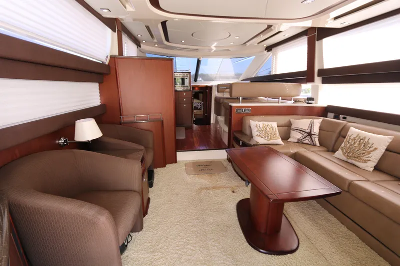 Family Time Yacht Photos Pics Luxurious interior of a 2013 Meridian 441 Sedan yacht with elegant seating and decor.