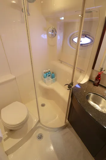 Family Time Yacht Photos Pics Bathroom interior of 2013 Meridian 441 Sedan yacht with shower and sink.