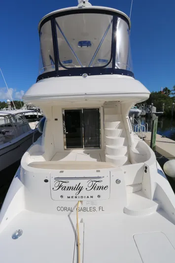 Family Time Yacht Photos Pics 2013 Meridian 441 Sedan yacht docked, featuring spacious deck and elegant design.