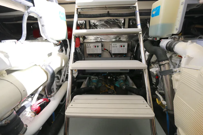 Family Time Yacht Photos Pics Engine room of 2013 Meridian 441 Sedan yacht with visible machinery and equipment.