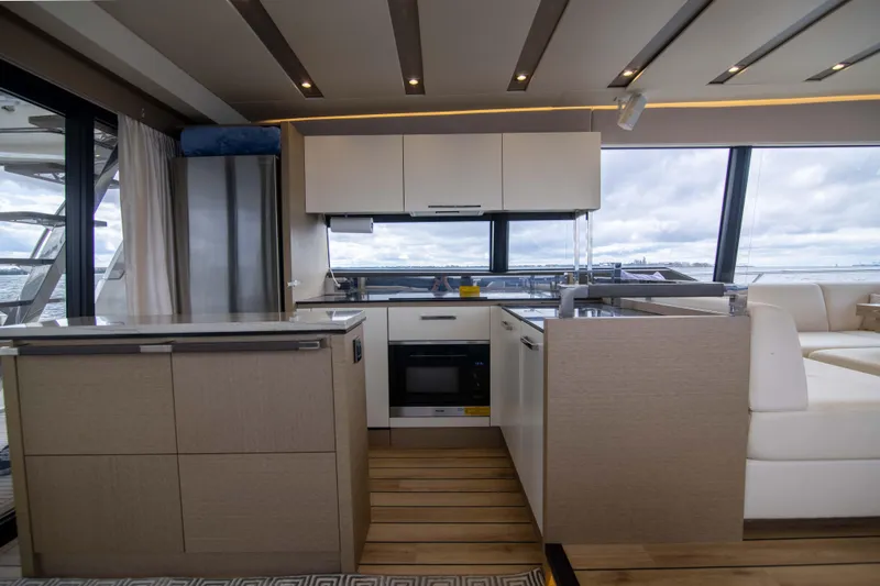 Prestige Worldwide Yacht Photos Pics Modern kitchen interior on 2018 Prestige 680 Flybridge yacht with sleek design and ocean view.