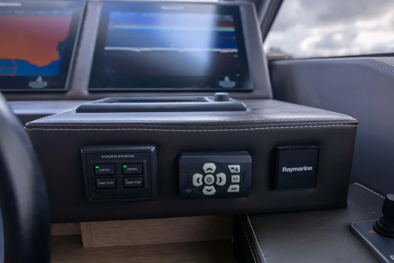 Prestige Worldwide Yacht Photos Pics Control panel of 2018 Prestige 680 Flybridge yacht with navigation screens.