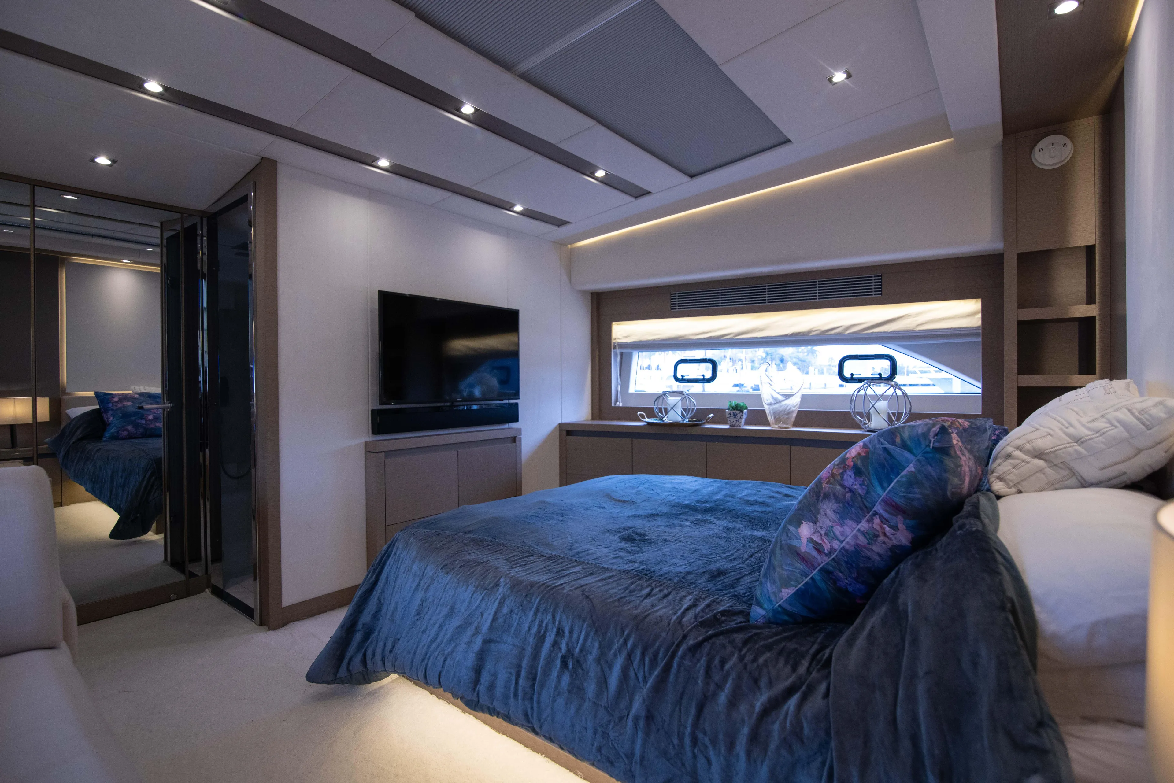 Prestige Worldwide Yacht Photos Pics Luxurious bedroom interior of 2018 Prestige 680 Flybridge yacht with modern decor and ambient lighting.