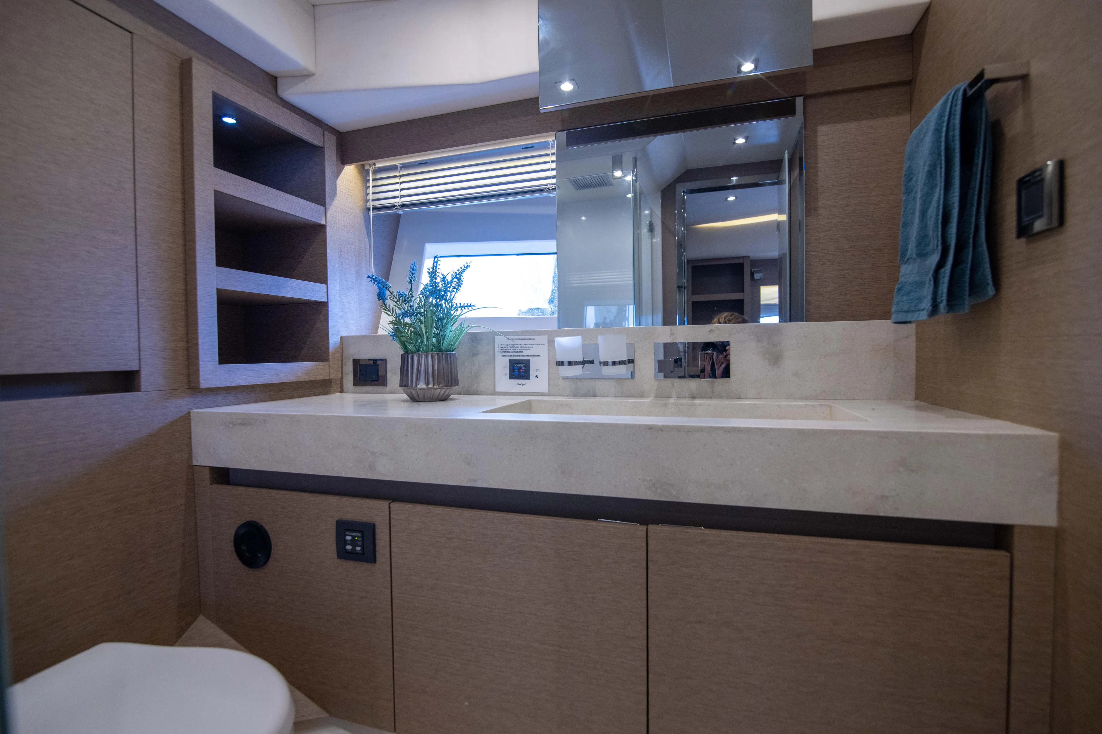 Prestige Worldwide Yacht Photos Pics Luxurious bathroom interior of 2018 Prestige 680 Flybridge yacht with modern fixtures and decor.