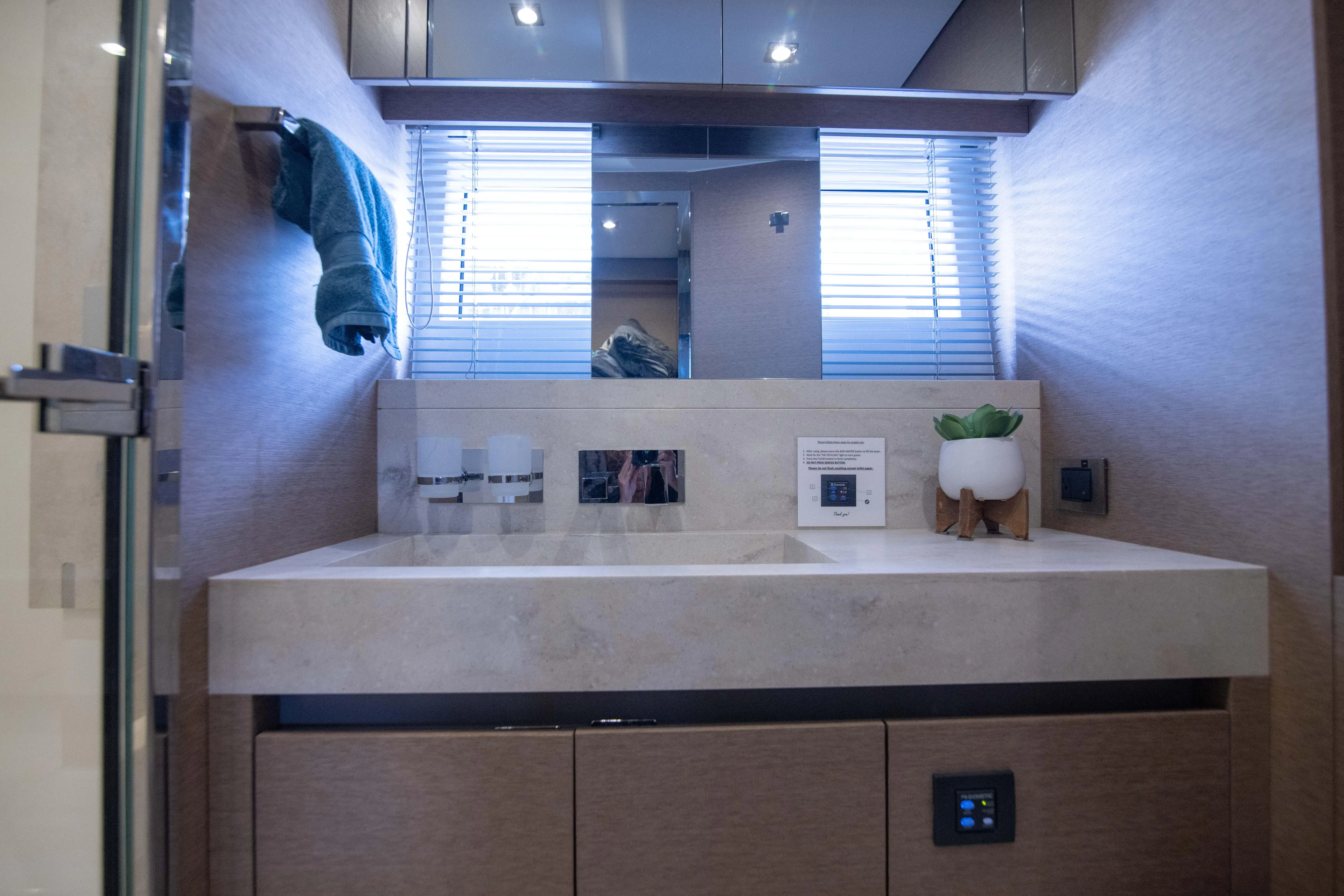 Prestige Worldwide Yacht Photos Pics Luxurious bathroom interior of 2018 Prestige 680 Flybridge yacht with modern fixtures.