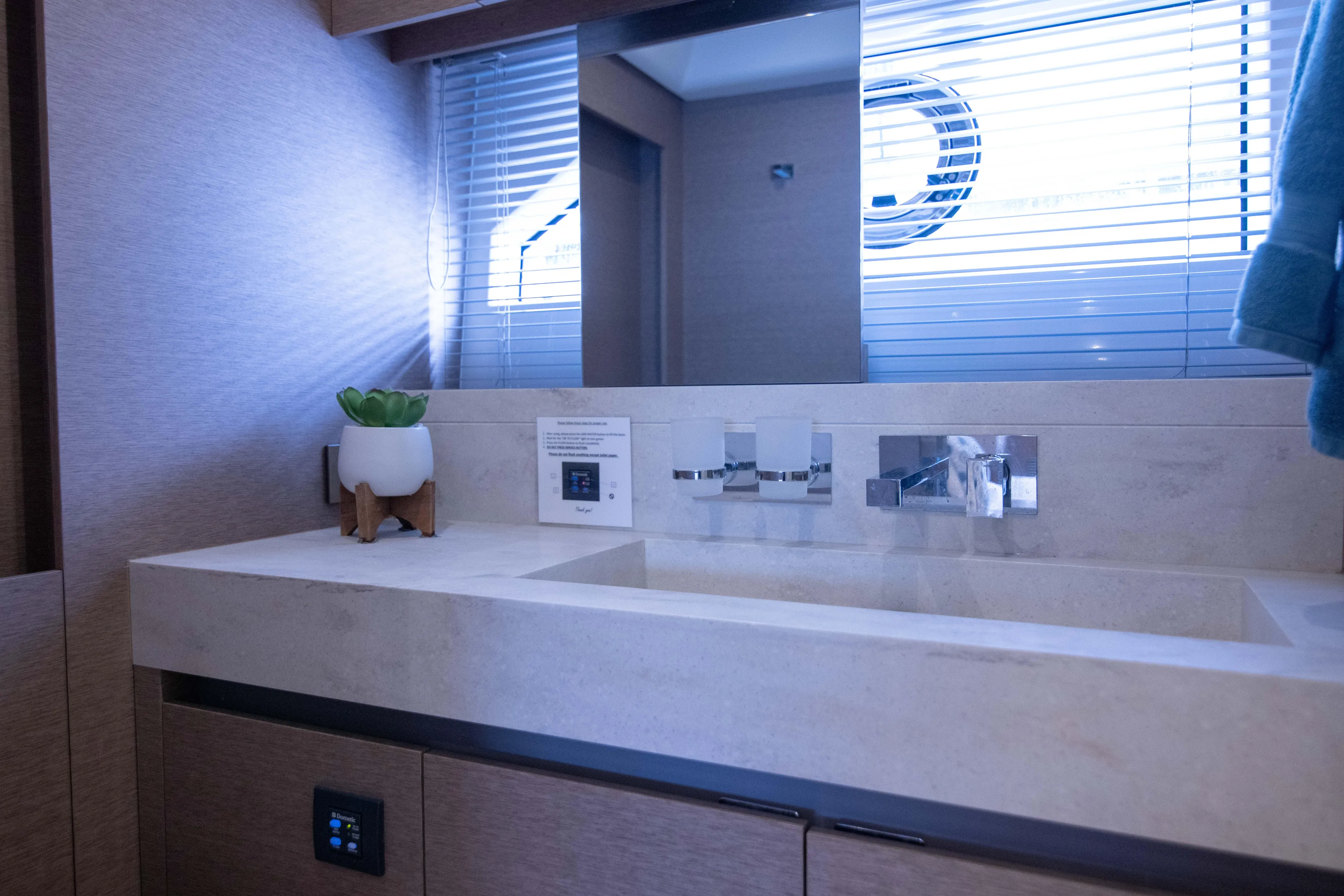 Prestige Worldwide Yacht Photos Pics Luxurious bathroom interior of 2018 Prestige 680 Flybridge yacht with modern sink and decor.