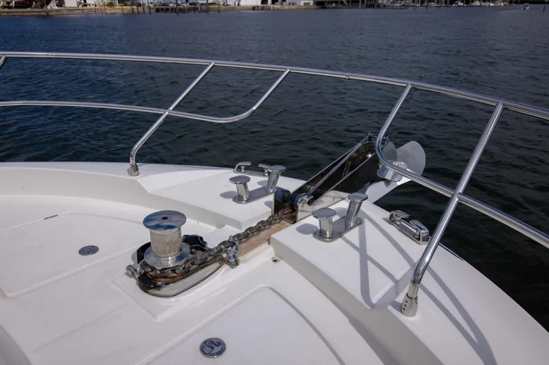 Prestige Worldwide Yacht Photos Pics Bow of 2018 Prestige 680 Flybridge yacht with anchor and railing.