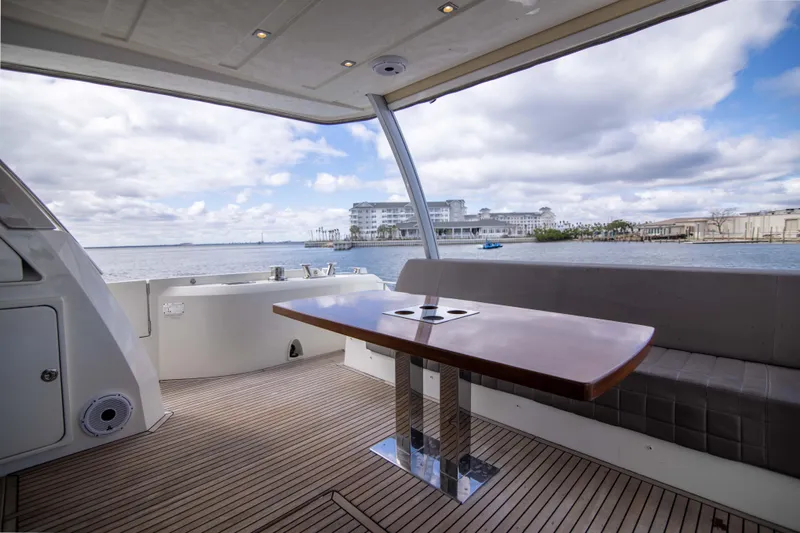 Prestige Worldwide Yacht Photos Pics Luxurious 2018 Prestige 680 Flybridge yacht with elegant seating and scenic waterfront view.