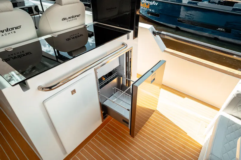  Yacht Photos Pics Interior of 2025 De Antonio Yachts D50 Coupé with open drawer and sleek design.