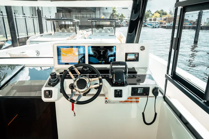  Yacht Photos Pics 2025 De Antonio Yachts D50 Coupé helm with modern navigation displays and controls.