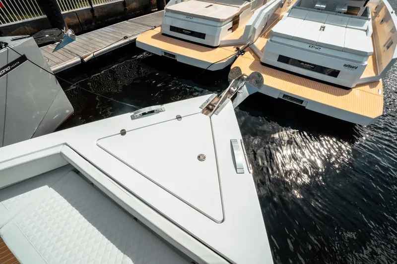  Yacht Photos Pics 2025 De Antonio Yachts D50 Coupé docked, showcasing sleek design and modern features.