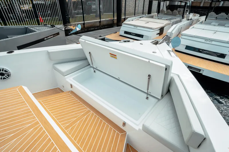  Yacht Photos Pics 2025 De Antonio Yachts D50 Coupé with open storage compartment and sleek deck design.