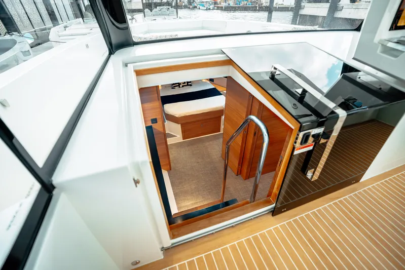  Yacht Photos Pics 2025 De Antonio Yachts D50 Coupé interior cabin entrance with modern design and wooden accents.
