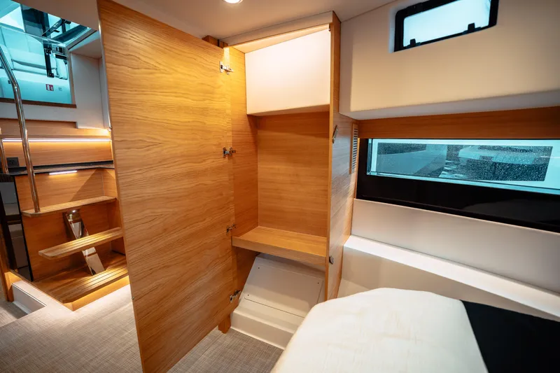  Yacht Photos Pics Interior of 2025 De Antonio Yachts D50 Coupé, featuring wooden cabinetry and modern design.
