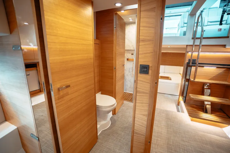 Yacht Photos Pics Luxurious interior of 2025 De Antonio Yachts D50 Coupé with modern wood finishes.