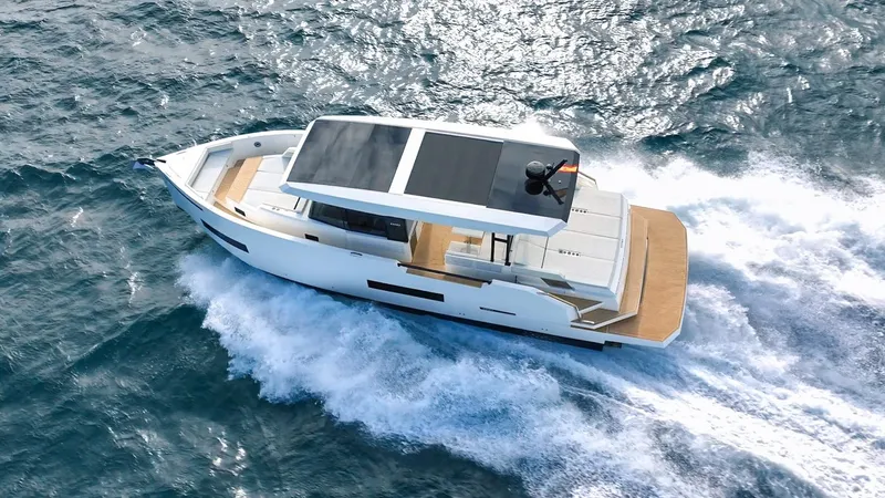  Yacht Photos Pics 2025 De Antonio Yachts D50 Coupé cruising on open water, showcasing sleek design and luxury.