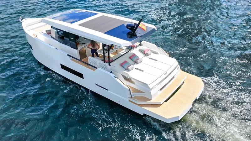  Yacht Photos Pics 2025 De Antonio Yachts D50 Coupé cruising on open water, showcasing sleek design and luxury features.