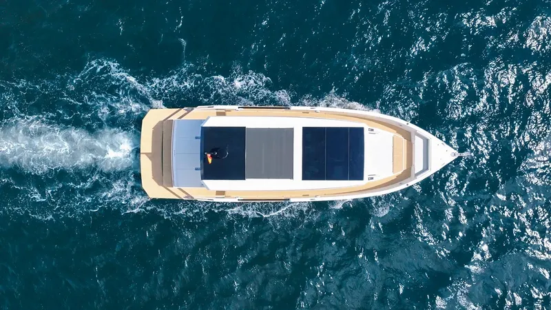  Yacht Photos Pics 2025 De Antonio Yachts D50 Coupé cruising on open water, aerial view.