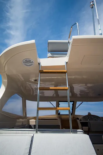 36 Fly Yacht Photos Pics 2025 Toy 36 Fly yacht ladder against blue sky.