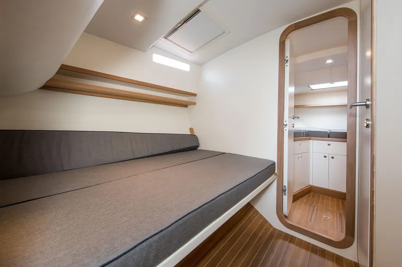 36 Fly Yacht Photos Pics Modern cabin interior of 2025 Toy 36 Fly yacht with sleek design and wooden flooring.