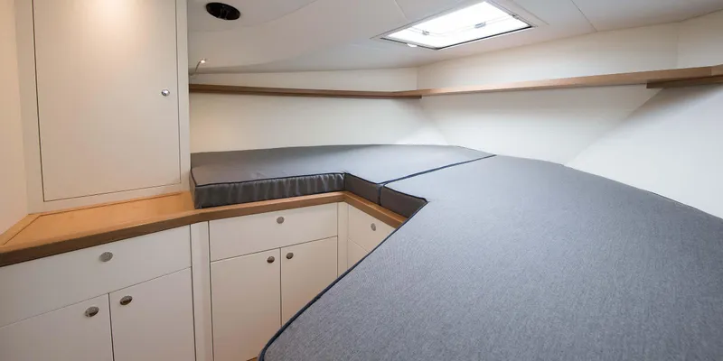 36 Fly Yacht Photos Pics 2025 Toy 36 Fly yacht interior with modern cabinetry and cushioned seating.