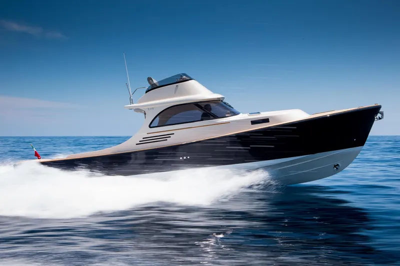 36 Fly Yacht Photos Pics 2025 Toy 36 Fly yacht cruising on open sea under clear blue sky.