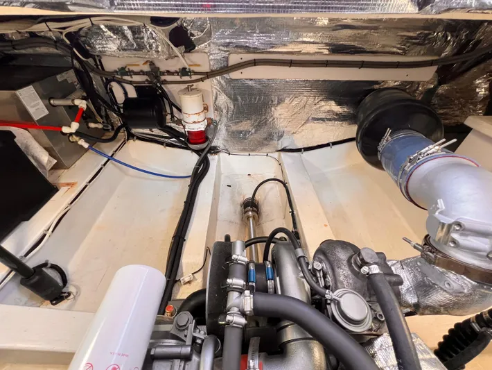 Indigo Yacht Photos Pics Engine room of 2007 Bruckmann 34e boat, showcasing mechanical components and wiring.