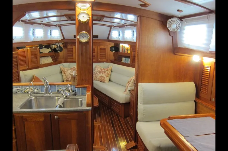 Dreamwalker Yacht Photos Pics Luxurious 2008 Gozzard 41B yacht interior with elegant wood finish and cozy seating area.