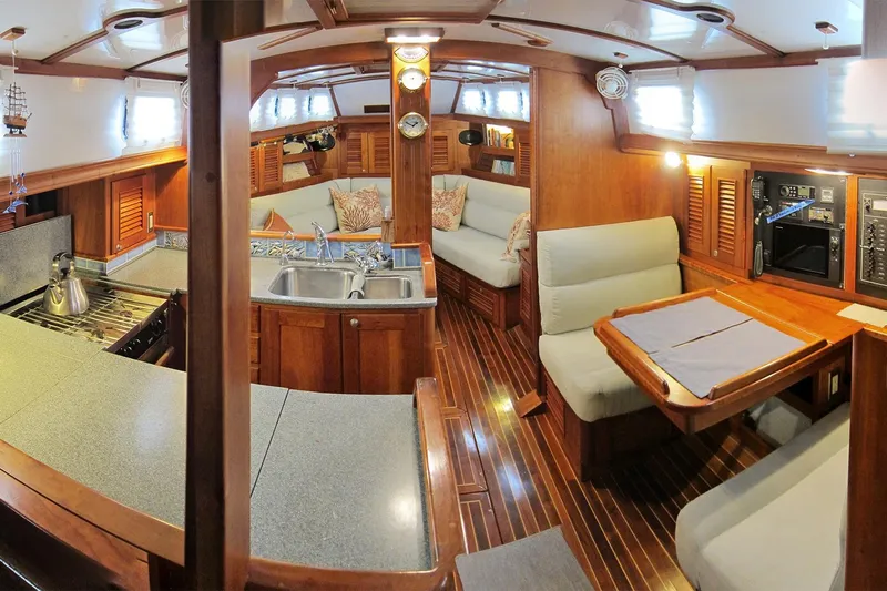 Dreamwalker Yacht Photos Pics Interior of 2008 Gozzard 41B yacht with wood finish and cozy seating area.